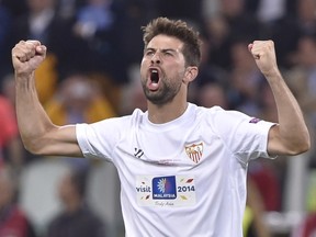 Sevilla's defender Coke celebrates after scoring a penalty during the penalty shoot out during the UEFA Europa league final football match between Benfica and Sevilla on May 14, 2014 at the Juventus stadium in Turin. (AFP)
