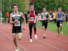 Ethan Dupont of St. Patrick's powers down the homestraight to win the junior boys 400m run title with a time of 54.11 seconds at the 2014 LSSAA Track and Field Championships. (SHAUN BISSON, The Observer)