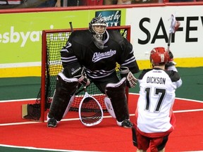 Calgary Roughnecks Curtis Dickson takes a penalty shot against Edmonton Rush goalie Aaron Bold in NLL playoff action at the Scotiabank Saddledome in Calgary, Alberta, on May 10, 2014. Dickson scored to send the game into overtime which the Roughnecks won 12-11. Mike Drew/Calgary Sun/QMI AGENCY