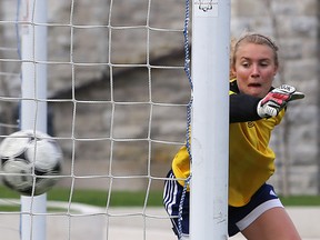 Kingston Blues goaltender Carley Gordon watches the ball hit the back of the net on a penalty kick early in the Kingston Area senior girls soccer quarter-final match against Sydenham Wednesday at Nixon Field at Queen's University. The Blues won 2-1. (Elliott Ferguson/The Whig-Standard)