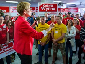 Kathleen Wynne lays out a scare scenario of Ontario with Tim Hudak as premier to Liberal supporters at the campaign headquarters of London-Fanshawe candidate Marcel Marcellin on Wednesday. (MIKE HENSEN, The London Free Press)