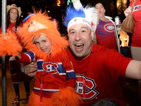 Happy fans of the Montreal Canadiens took to the streets of downtown Montreal to celebrate on May 14, 2014 after their team's 3-1 win over the Bosotn Bruins. (SÉBASTIEN SAINT-JEAN/QMI Agency)
