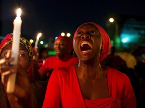 A woman shouts during a vigil in Abuja calling for the release of Nigerian schoolgirls abducted in the remote village of Chibok, May 15, 2014.  REUTERS/Joe Penney