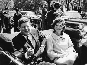 Former U.S. President John F. Kennedy and first lady Jackie Kennedy sit in a car in front of Blair House during the arrival ceremonies for Habib Bourguiba, president of Tunisia, in Washington, in this handout image taken on May 3, 1961. (REUTERS/Abbie Rowe/The White House/John F. Kennedy Presidential Library)