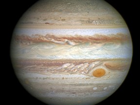 Jupiter's most distinctive feature - a giant red spot, is seen in this April 21, 2014, NASA handout photo taken by the Hubble Space Telescope of the planet. The red spot, that is bigger than Earth, - is shrinking, images from the Hubble Space Telescope released on May 15, 2014, showed. (REUTERS/NASA, ESA, Goddard Space Center/Handout via Reuters)