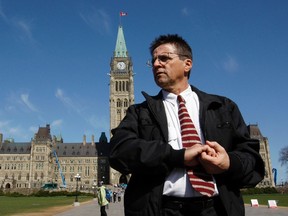 Ottawa professor Hassan Diab leaves the Parliament Hill following a news conference in Ottawa April 13, 2012. REUTERS/Blair Gable