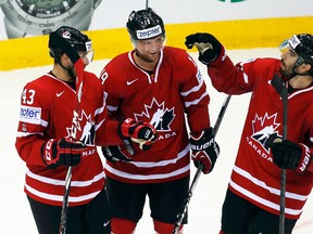 Canada's Cody Hodgson (centre) celebrates his goal against Denmark with teammates during the world hockey championship at Chizhovka Arena in Minsk, Belarus, May 15, 2014. (VASILY FEDOSENKO/Reuters)