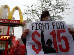 Demonstrators protest in front of a McDonald's restaurant in Chicago, Illinois, May 15, 2014. (REUTERS/Jim Young)
