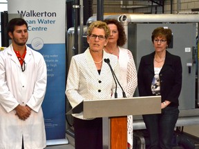 Ontario premier Kathleen Wynne gives her prepared remarks during a campaign stop in Walkerton, Thursday, May 15, 2014. The Liberal leader was at the Walkerton Clean Water Centre not only to commit $30 million in funding over 10 years for the facility if the Liberals are re-elected, but also to commemorate the 14th anniversary of the Walkerton water crisis. She also slammed the Progressive Conservative plan to slash 100,000 public service jobs, warning that "cuts have consequences." (PATRICK BALES, QMI Agency)