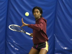 Chantae Robinson, of Marymount Academy, returns a volley during the girls singles high school tennis finals at the Sudbury Indoor Tennis Centre on Thursday.