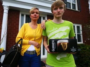 Angela Parsons, with her son Evan Parsons, outside their house in Oakville on May 15, 2014. (Dave Abel/Toronto Sun)