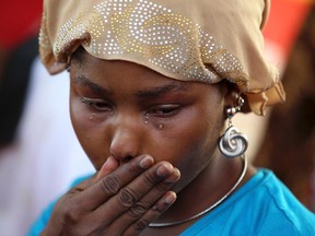A protester cries during a sit-in rally for the abducted schoolgirls, at the Unity Fountain.

REUTERS/Afolabi Sotunde