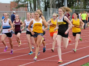 La Salle’s Heather Jaros, right, finished in first place in the senior girls 1,500 metres Thursday on the opening day of the Kingston Area Secondary Schools Athletic Association track and field championships at CaraCo Field. (Julia McKay/The Whig-Standard)