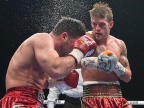 Kingston boxer Tyler Asselstine, in action against Baha Laham in Montreal in February 2013, has a super-featherweight bout Friday night at Foxwoods Resort Casino in Ledyard, Conn. (QMI Agency)