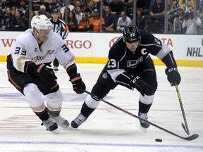Ducks winger Jakob Silfverberg fights for the puck with Kings' Dustin Brown during Game 6 on Wednesday. (USA TODAY SPORTS)