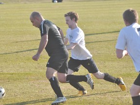 Cameron Schmidt of Portage United chases an opponent during United's game against Casuals May 15. (Kevin Hirschfield/THE GRAPHIC/QMI AGENCY)