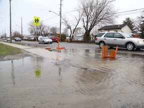 Gino Donato/The Sudbury Star
A ditch at First and Second avenues in Minnow Lake overflowed onto the sidewalk and in this 2014 file photo.