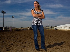 Jockey Shannon Beauregard (rides Just Win Baby) poses on the track during the post position draw for the Canadian Derby at Northlands Park in Edmonton, Alta., on Wednesday, Aug. 14, 2013. Codie McLachlan/Edmonton Sun/QMI Agency