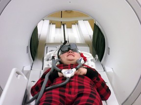 Emily Burtwistle, 12, watches a movie during an MRI with technology recently acquired by the Children’s Health Foundation. Available at the Children’s Hospital at London Health Sciences Centre, the movie-screening goggles are helping young patients stay off sedatives during MRIs. (Photo supplied).