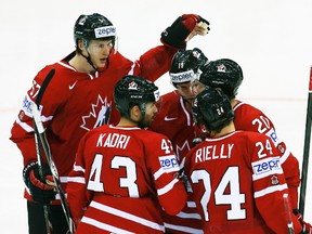 Canada's Cody Hodgson (third right) celebrates his goal against Italy with teammates during their world hockey championship game at Chizhovka Arena in Minsk, Belarus, May 16, 2014. (VASILY FEDOSENKO/Reuters)
