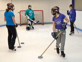 19-year-old Taylor Campbell (far right) works with a trio of Tillsonburg ringette players on the mini ice pad at the Tillsonburg Community Centre.