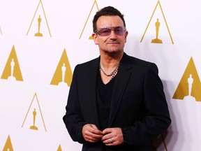 Musician Bono arrives at the 86th Academy Awards nominees luncheon in Beverly Hills, California February 10, 2014.  REUTERS/Mario Anzuoni