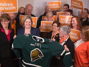 Ontario NDP leader Andrea Horwath was presented with a London Knights jersey by London North Centre candidate Judy Bryant in London on Friday. DEREK RUTTAN/London Free Press/QMI Agency