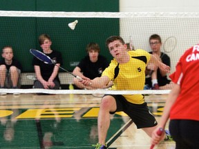 Caine Smithaniuk shows his touch around the net as he returns a volley from his opponent during an exhibition match at Memorial Composite High School on May 13. - Gord Montgomery, Reporter/Examiner