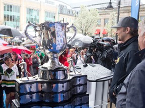 Former London Knight player Rob Schremp talks to a crowd as they gather to see the Memorial Cup after it was paraded through the city to Jubilee Square outside of the Covent Garden Market in London, Ontario on Thursday May 15, 2014.
CRAIG GLOVER/The London Free Press/QMI Agency