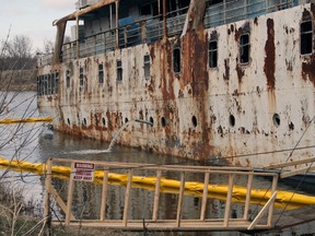 After 23 years of standing in a Selkirk slough, the Canadian Coast Guard is seeing if the 1,009-ton MS Lord Selkirk II will float. The Coast Guard began working on the decrepit ship May 13, after a report was issued in the beginning of March that the vessel was significantly polluting the Red River it rots in. (AMANDA LEFLEY/QMI Agency)