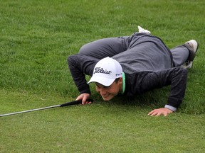 Swade Hall uses the spider-style of reading greens while he putts. Hall says he takes inspiration from PGA Tour star Camillo Villegas, who made the unorthodox stance popular. (SHAUN BISSON, The Observer)