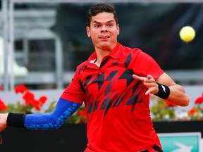 Milos Raonic of Canada returns the ball to Jeremy Chardy of France during their men's singles match at the Rome Masters tennis tournament May 16, 2014. (REUTERS)