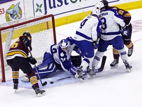 Marlies goalie Drew MacIntyre gets the knob of his stick on this close-in chance by Wolves’ Jani Hakanpaa last night at the Ricoh Coliseum, one of 30 saves he made in a series-clinching 4-0 win. (Dave Thomas, Toronto Sun)