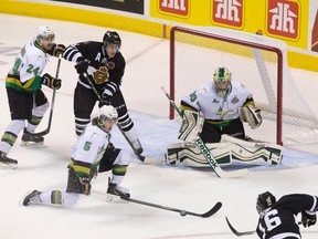 Foreurs defenceman Guillaume Gelinas attempts to block a shot by Knights forward Max Domi on Foreurs goaltender Antoine Bibeau during Memorial Cup round robin action in London, Ont., on Friday, May 16, 2014. (Craig Glover/QMI Agency)