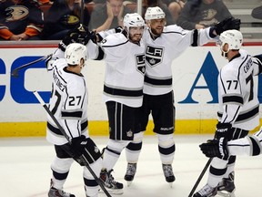 Kings right wing Marian Gaborik (12) celebrates with teammates Drew Doughty (8) , Alec Martinez (27) , Jeff Carter (77) and Anze Kopitar (11) after scoring a goal against the Ducks during second period action in Game 7 of their second round playoff series in Anaheim on Friday, may 16, 2014. (Robert Hanashiro/USA TODAY Sports)