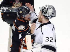 Ducks winger Teemu Selanne (left) greets Kings goalie Jonathan Quick after Game 7 of their second round playoff series in Anaheim on Friday, May 16, 2014. The Kings won 6-2, ending Selanne's NHL career. (Robert Hanashiro/USA TODAY Sports)