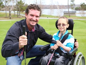 Former Montreal Canadiens player Brian Savage and Benjamin Pare, 6, in this file photo promoting the Brian Savage Mulligans for NEO Kids Golf Classic at the Idylwylde Golf and Country Club.