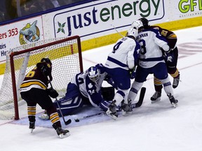 Marlies goalie Drew MacIntyre gets the knob of his stick on this close-in chance by Wolves' Jani Hakanpaa last night at the Ricoh Coliseum, one of 30 saves he made in a series-clinching 4-0 win. (DAVE THOMAS/Toronto Sun)