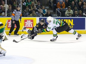 London Knights forward Mitch Marner goes airborne while getting a shot away on Val-d'Or Foreurs goaltender Antoine Bibeau as Foreurs defenceman Ryan Graves tries to stop him during their 2014 Memorial Cup round robin hockey game at Budweiser Gardens in London, Ontario on Friday May 16, 2014.
CRAIG GLOVER The London Free Press / QMI AGENCY