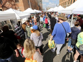 Edmontonians take in the first outdoor day of the City Market Downtown, in Edmonton Alta., on Saturday May 17, 2014. The farmers' market is open Saturdays 9 am to 3 pm and is located along 104 Street between Jasper Avenue and 102 Avenue.  David Bloom/Edmonton Sun/QMI Agency