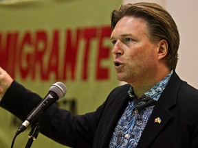 Alberta Minister of Jobs, Skills, Training and Labour Thomas Lukaszuk speaks at a community event put on by Migrante Alberta to talk to workers about the impact of the moratorium on temporary foreign workers, at the University of Alberta's Faculty of Education in Edmonton on Saturday. (CODIE MCLACHLAN/Edmonton Sun)