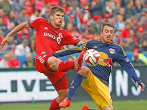 TFC defender Nick Hagglund clears the ball during Saturday's game against New York. (STAN BEHAL/Toronto Sun)