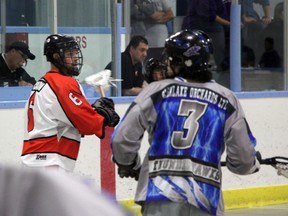 Point Edward Pacers captain Dan Charlton looks for a teammate to pass the ball to while being guarded by Conner Overstrom of the Niagara Thunderhawks during the 2nd period of their OLA Jr 'B' lacrosse game on Saturday, May 17. The Thunderhawks defeated Point Edward 12-8 to drop the Pacers' record to 1-5 on the year. SHAUN BISSON/THE OBSERVER/QMI AGENCY