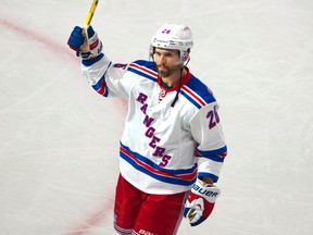 Rangers' Martin St. Louis salutes the crowd at the Bell Centre in Montreal after being named the game's first star on Saturday against the Canadiens. (QMI AGENCY/PHOTO)