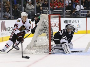 Kings goalie Jonathan Quick defends his net as Blackhawks’ Andrew Shaw circles earlier this season. (Getty Images)