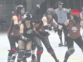 Action from the Headstone Honeys roller derby opener against Grave Diggers from Regina May 17. (Kevin Hirschfield/THE GRAPHIC/QMI AGENCY)