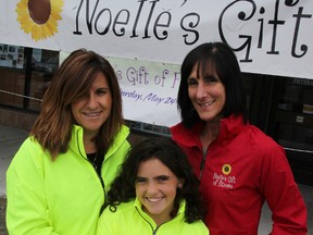 Two of the Noelle's Gift of Fitness organizers, Susan Ansara, left, and Marg Stewart, pose for a photo with Ansara's daughter Catherine Mageau, all sporting event jackets outside the Goodlife Fitness location in Sarnia. This year's May 24 fitness fundraiser for Noelle's Gifts also features events designed specifically for youth. TYLER KULA/ THE OBSERVER/ QMI AGENCY