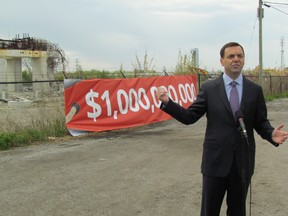 Progressive Conservative Leader Tim Hudak promises to launch a judicial inquiry into the Ontario Liberal government’s cancellation of two gas plants Sunday, May 18, 2014, while standing in front of what remains of one of the gas plants in Mississauga. (Antonella Artuso/Toronto Sun)