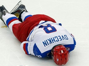 Russia's Alexander Ovechkin lays on the ice during the third period of their men's ice hockey World Championship Group B game against Germany at Minsk Arena in Minsk May 18, 2014. (REUTERS)