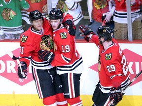 Chicago Blackhawks center Jonathan Toews (19) celebrates with teammates Marian Hossa (81) and Bryan Bickell (29) after scoring a goal against the Los Angeles Kings during the third period in game one of the Western Conference Final of the 2014 Stanley Cup Playoffs at United Center on May 18, 2014 in Chicago, IL, USA. (Jerry Lai/USA TODAY Sports)